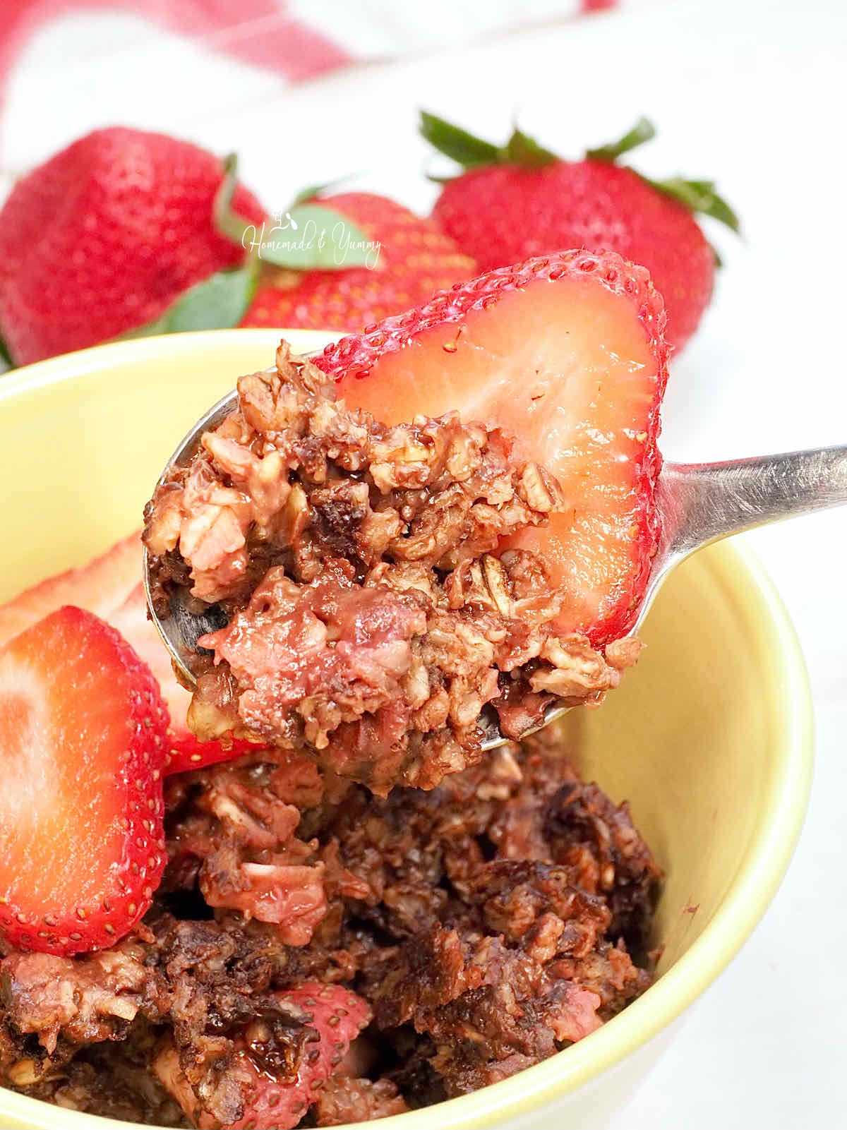 Cocoa baked oats for breakfast in a yellow bowl.