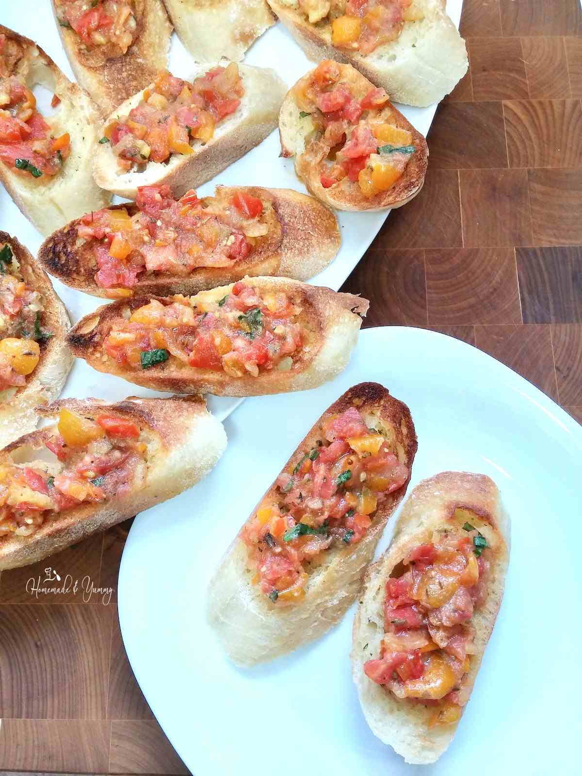 A platter of appetizers made with Fresh Tomato Bruschetta.