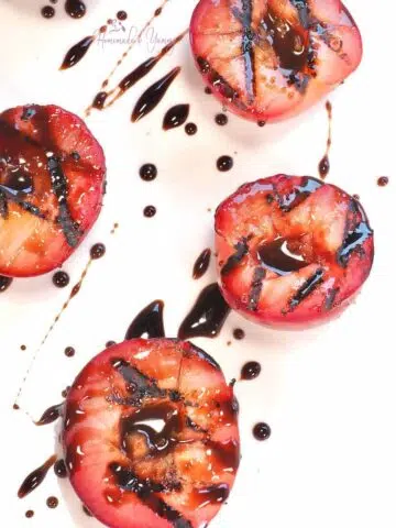 Grilled Plums drizzled with honey.