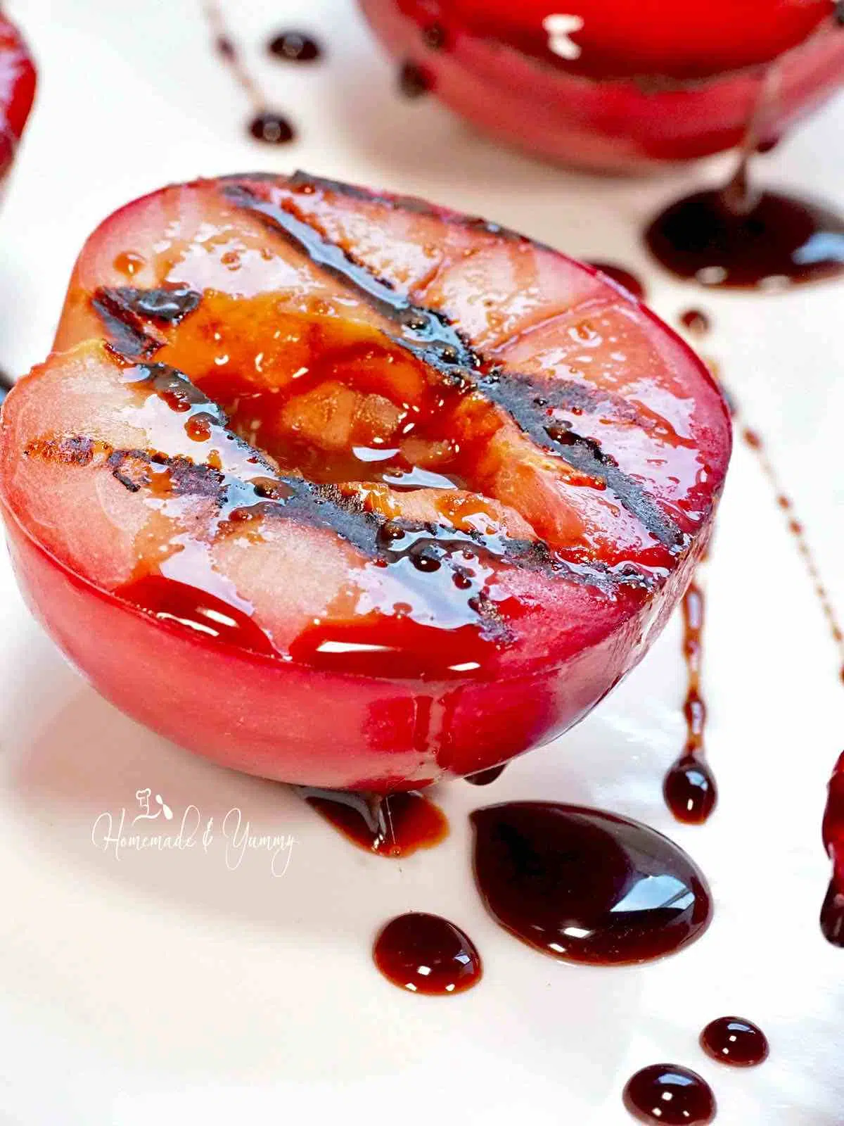 Red plum grilled with a chocolate honey glaze.
