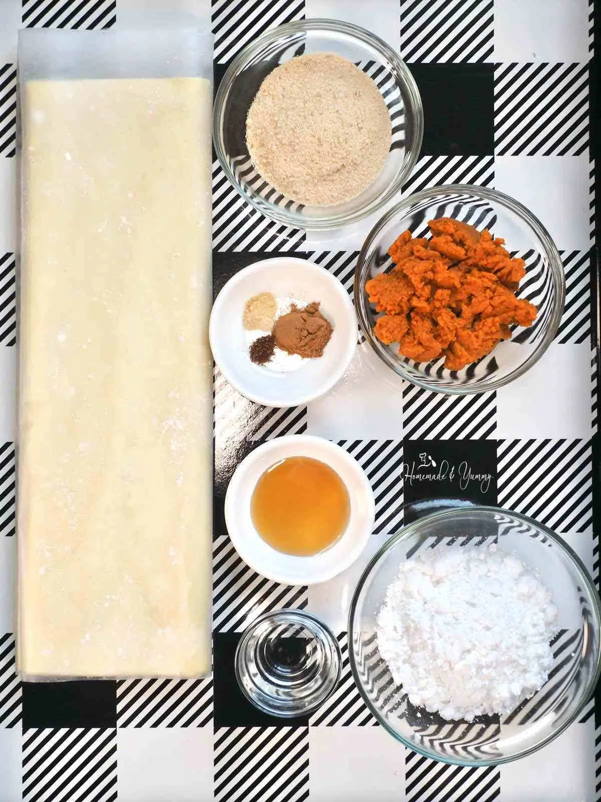 Ingredients to make pumpkin rolls with puff pastry.