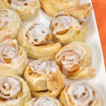 Puff Pastry Pumpkin Rolls on a white plate.
