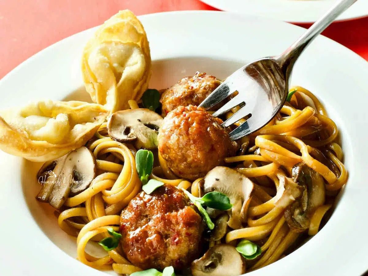 Chinese style spaghetti with meatballs.