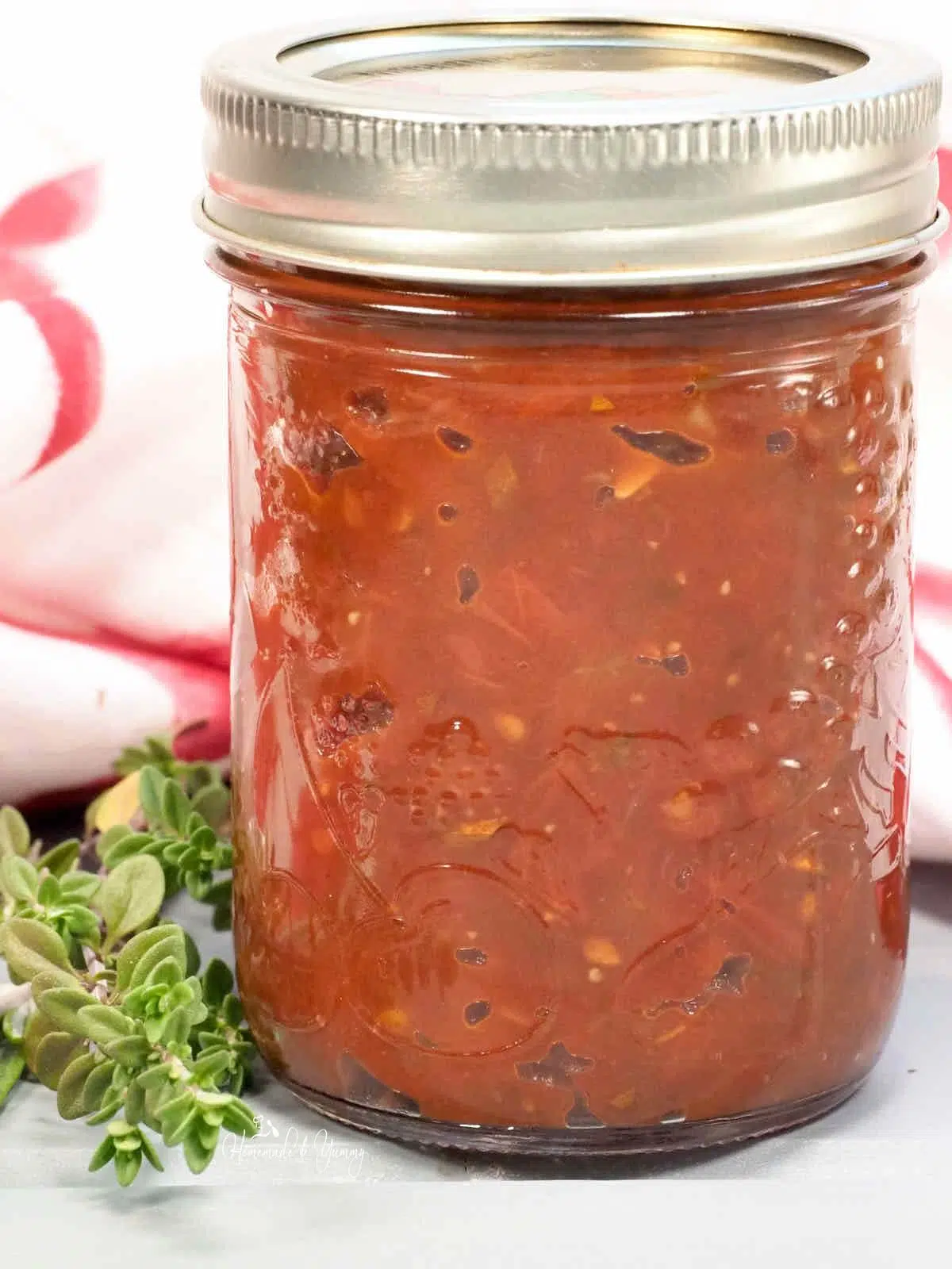 A jar of fresh tomato jam ready to eat.