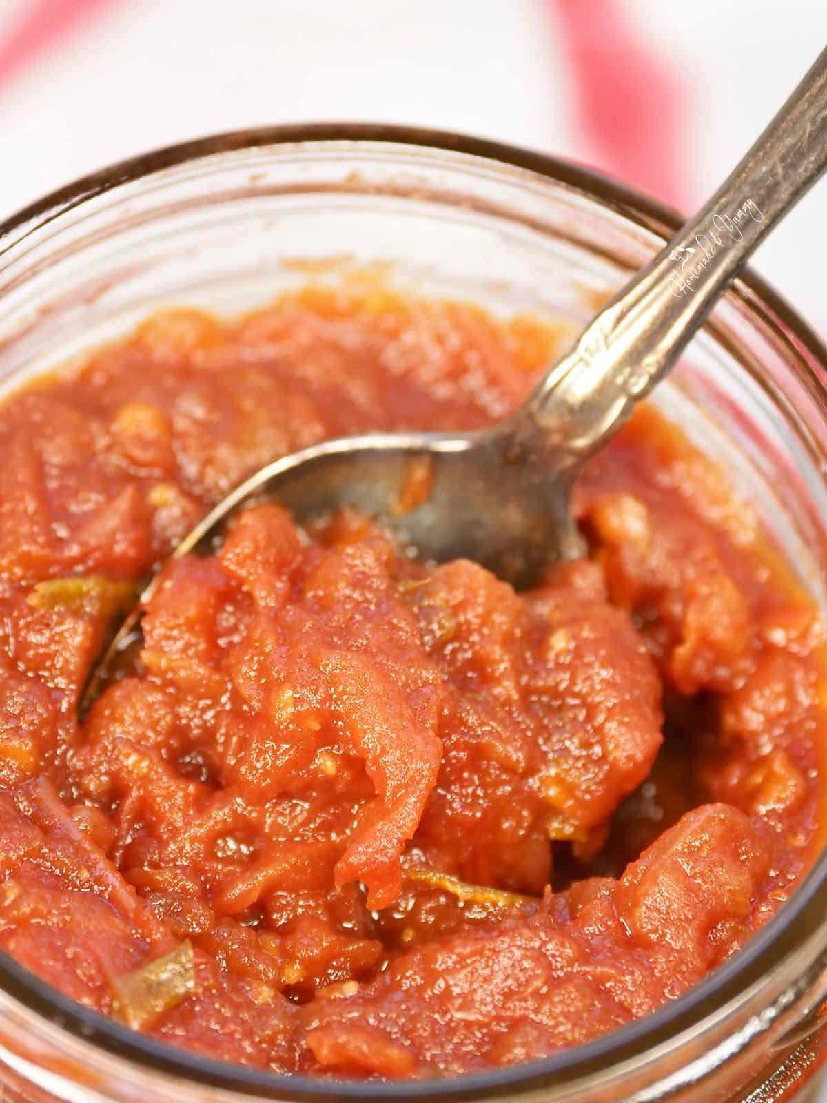 A spoonful of homemade tomato preserves.
