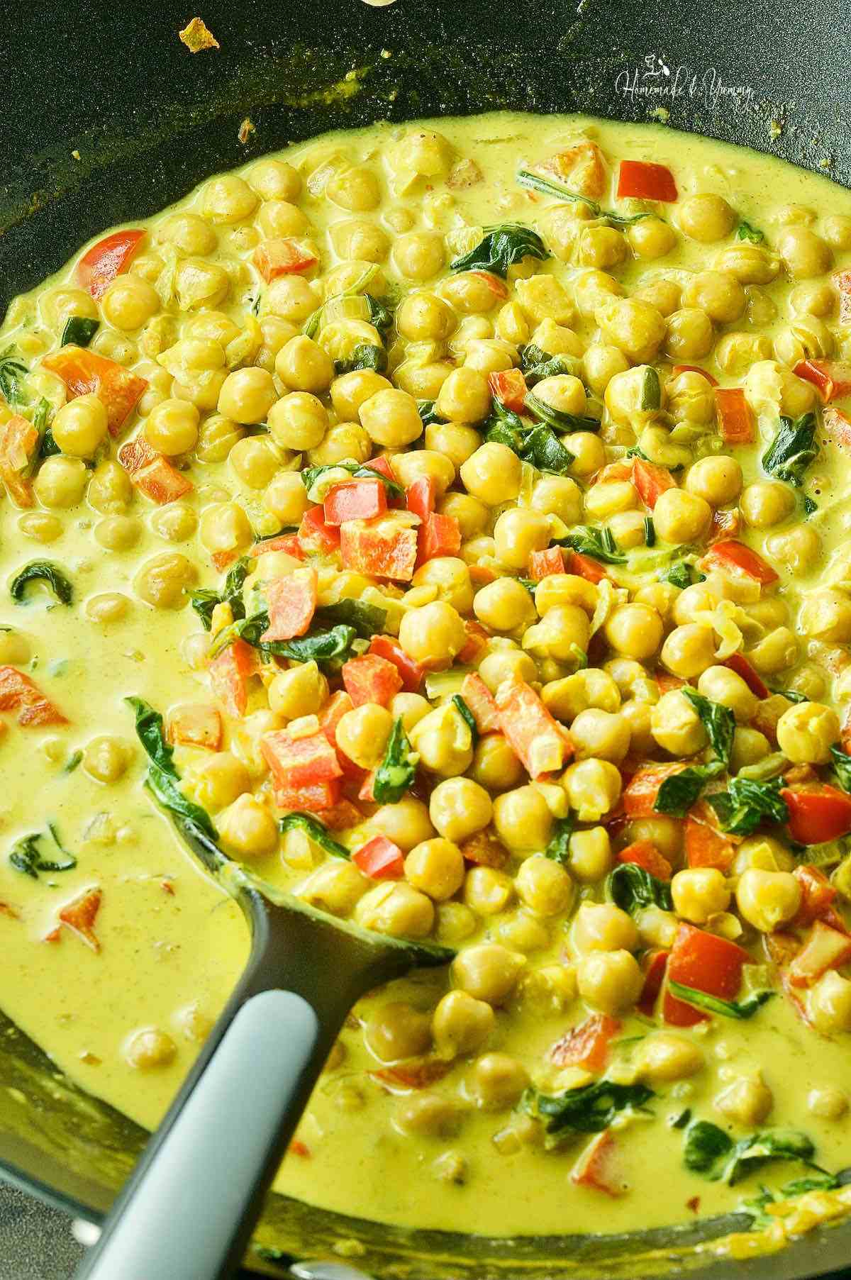 Cooking the chickpea coconut curry.