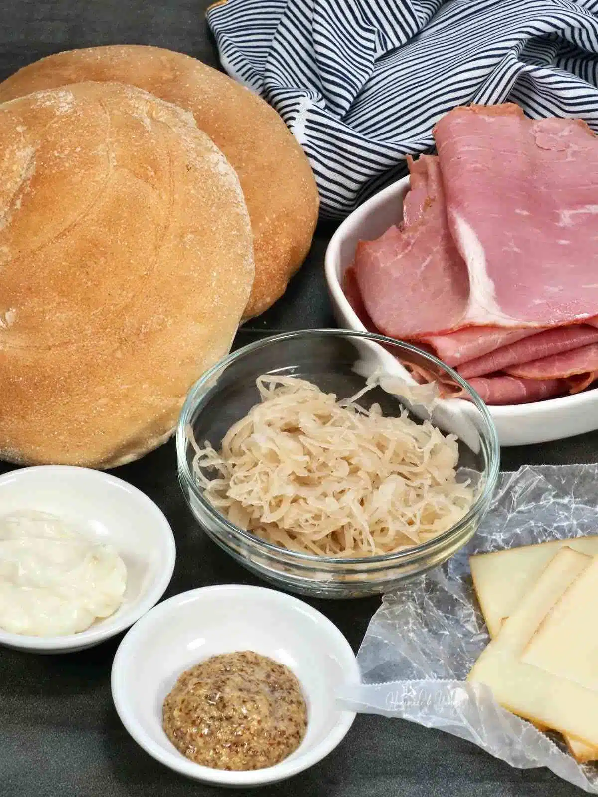 Ingredients needed to make a deli sandwich with corned beef.