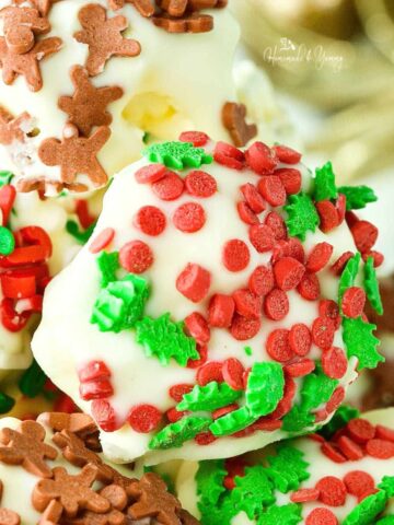 White Chocolate Popcorn Balls covered with Christmas sprinkles.