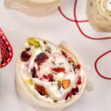 Holiday cream cheese pinwheels with cranberries and pistachios.