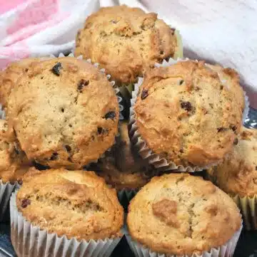 Cranberry Bran Flake Muffins piled on a plate.