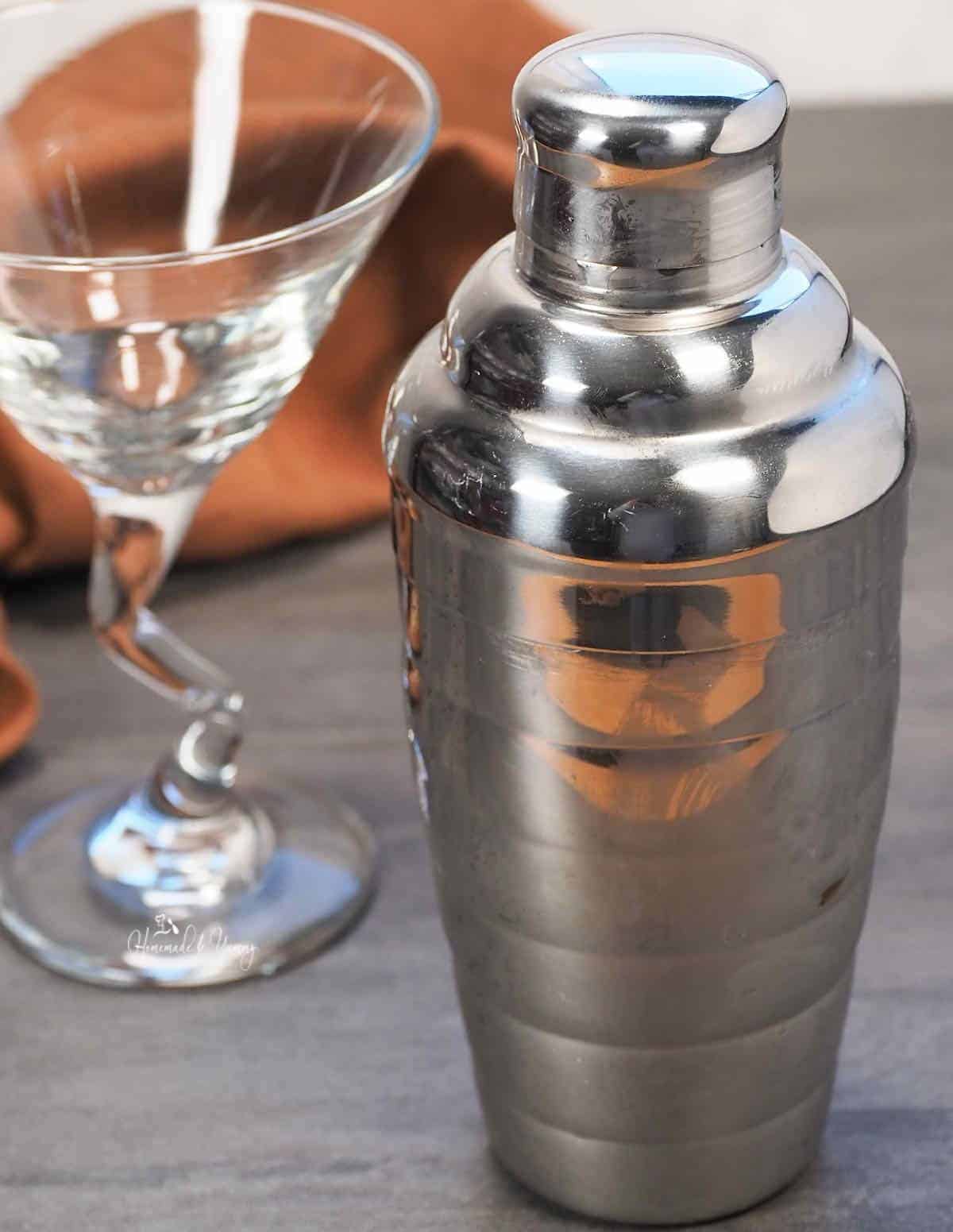 Martini glass and martini shaker.