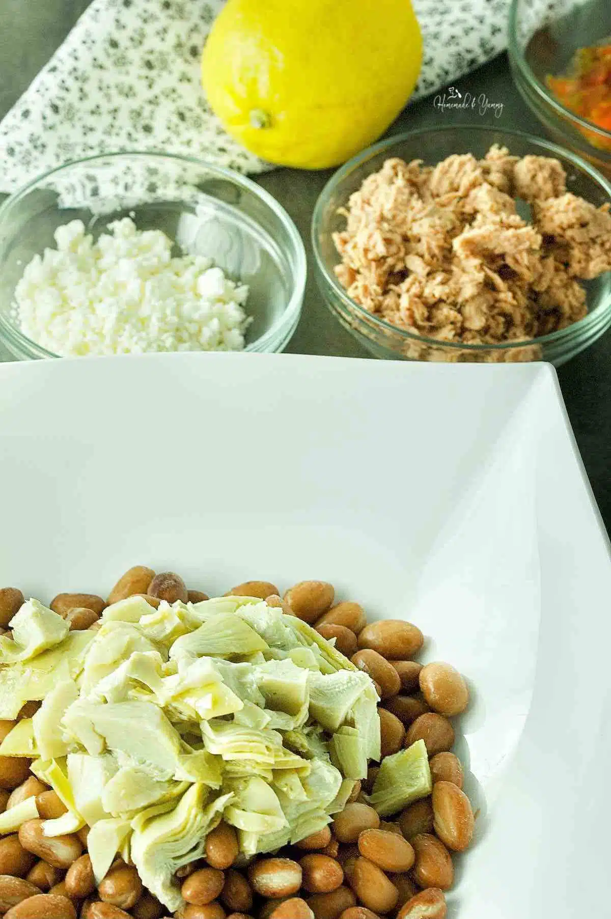 Ingredients to make a Mediterranean-style tuna and avocado salad.
