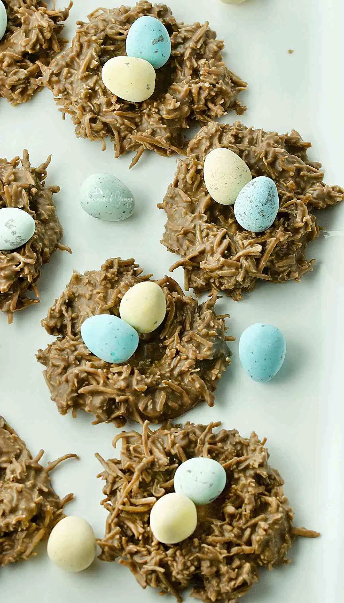 Easter no-bake chocolate coconut nests with mini eggs.
