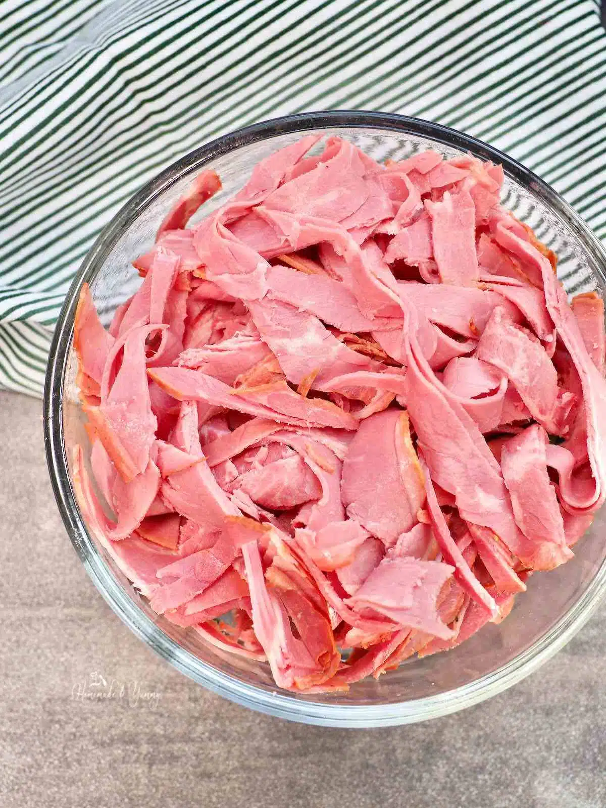 Sliced corned beef in a bowl.