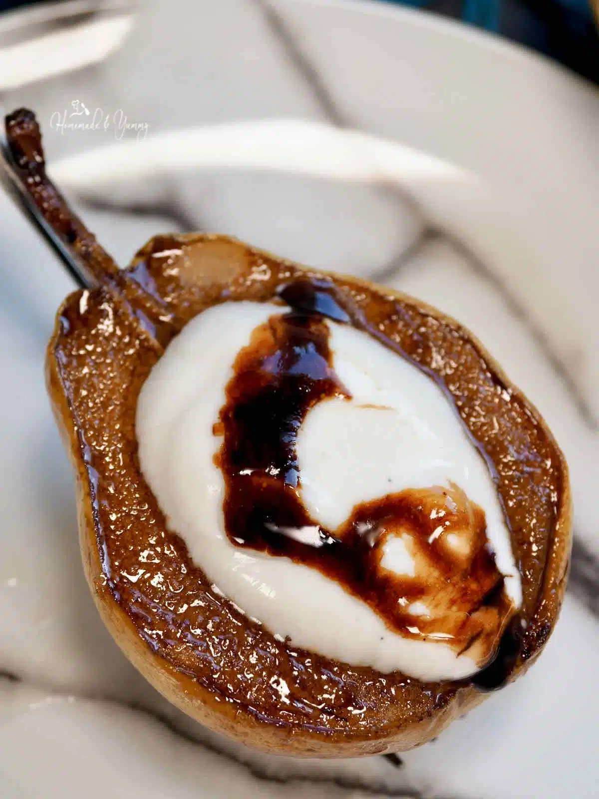 Yogurt and chocolate honey on a glazed pear.