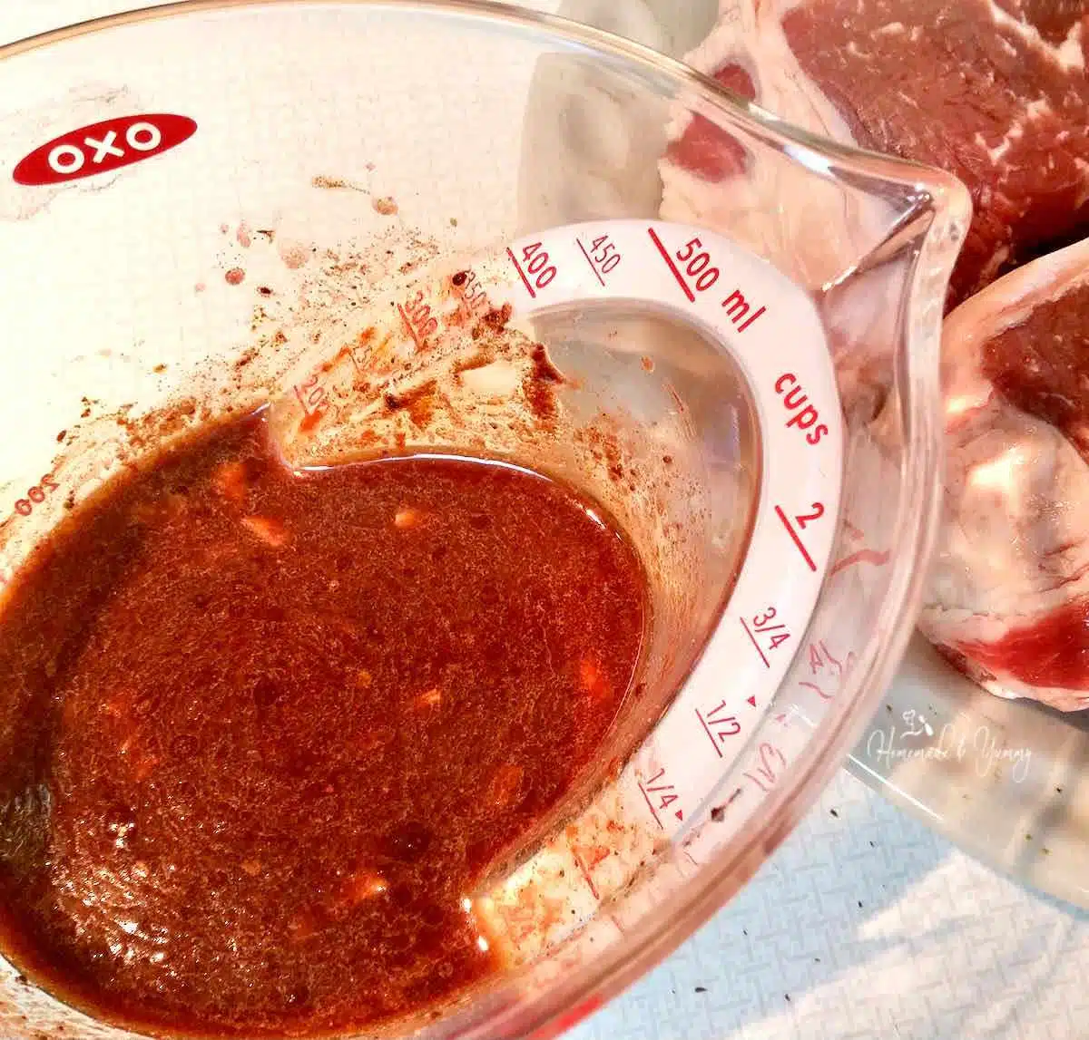 All the marinade ingredients in a measuring cup.
