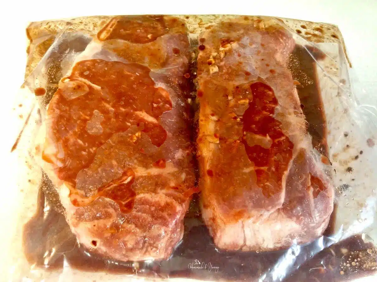 Steaks marinating in bag with Will's Special Marinade.