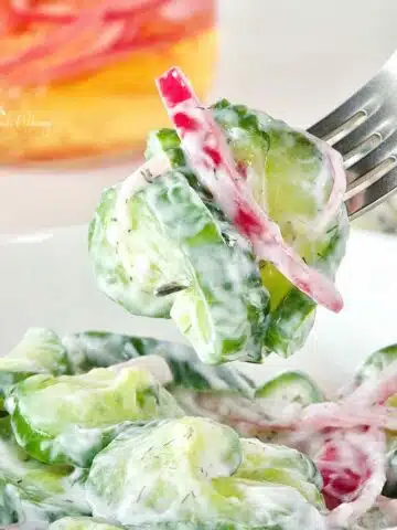 Creamy Cucumber Salad with onions.