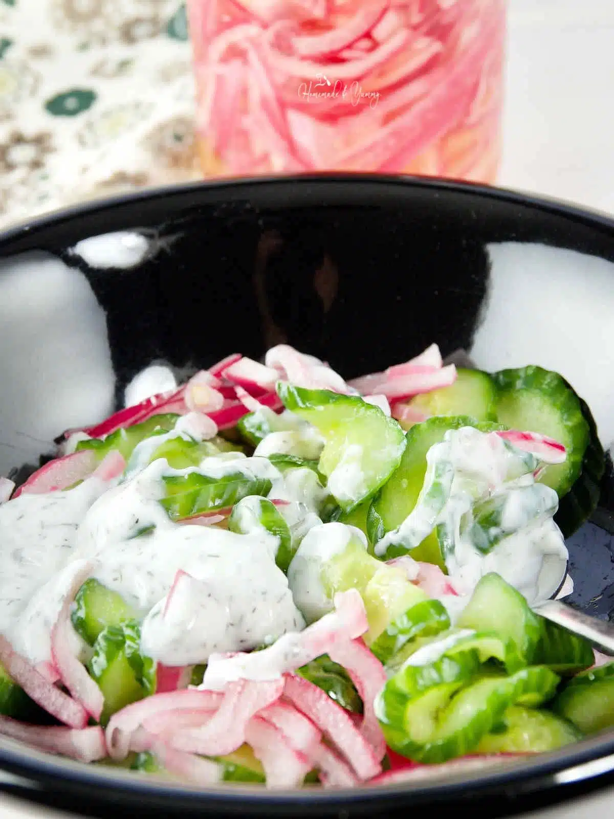 Sour cream and dill dressing with cucumbers and onions.