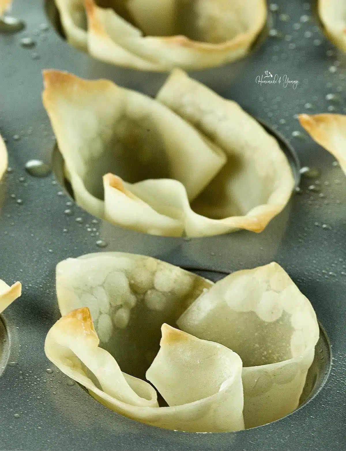 Baked wonton cups ready to fill with guacamole.