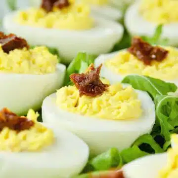 Devilled eggs flavoured with bacon and sun-dried tomatoes.