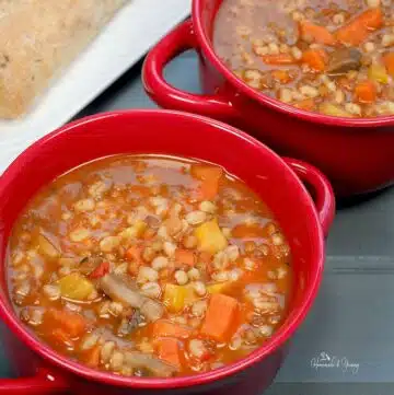 A bowl of vegetarian barley lentil soup ready to eat.