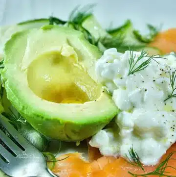 Cold smoked salmon plate with avocado and cottage cheese.