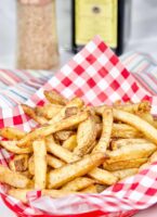Crispy golden brown spicy fries cooked in the air fryer.