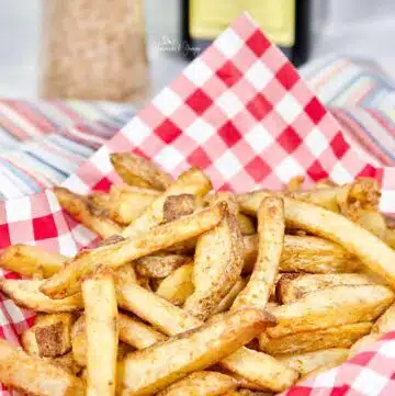 Crispy golden brown spicy fries cooked in the air fryer.