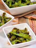 Grilled Japanese shishito peppers with togarashi seasoning.