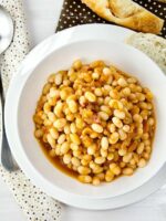 Pressure cooker BBQ beans with bacon in a bowl.