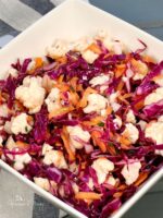 Raw cauliflower coleslaw with oil and vinegar dressing.