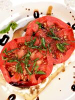 Open faced cheese and tomato sandwich.