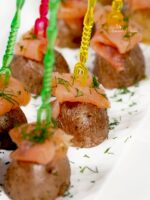 Bite size smoked salmon and potato appetizer.