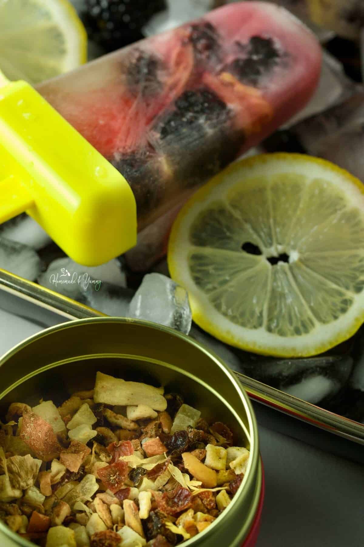 Ingredients to make lemon and blackberry popsicles.