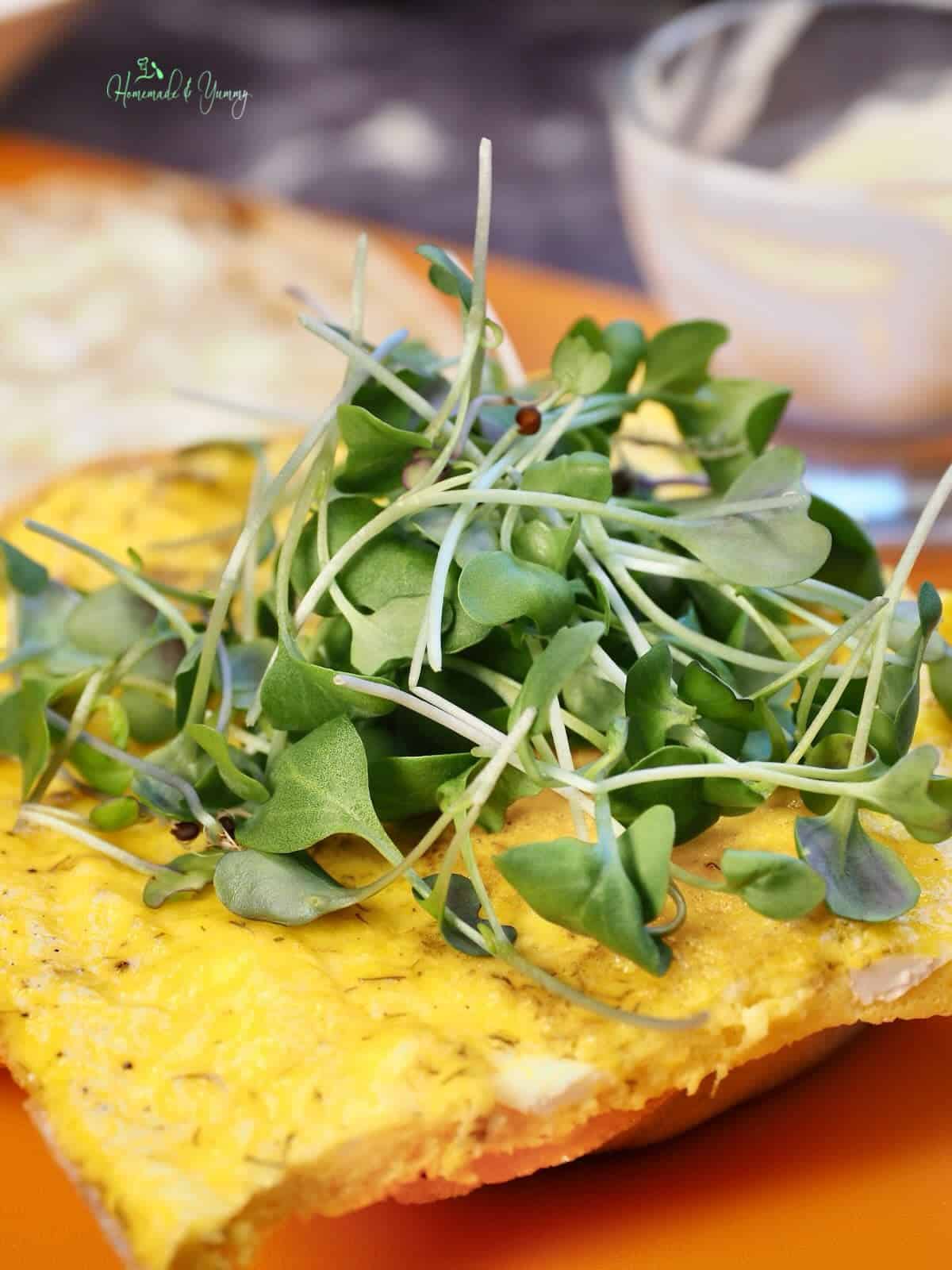 Micro greens on an egg sandwich.