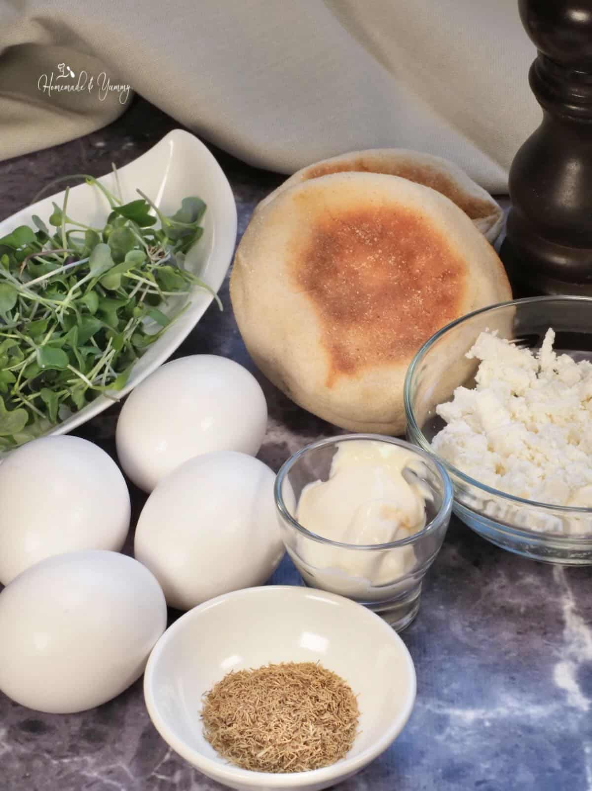 Ingredients to make baked eggs for sandwiches.