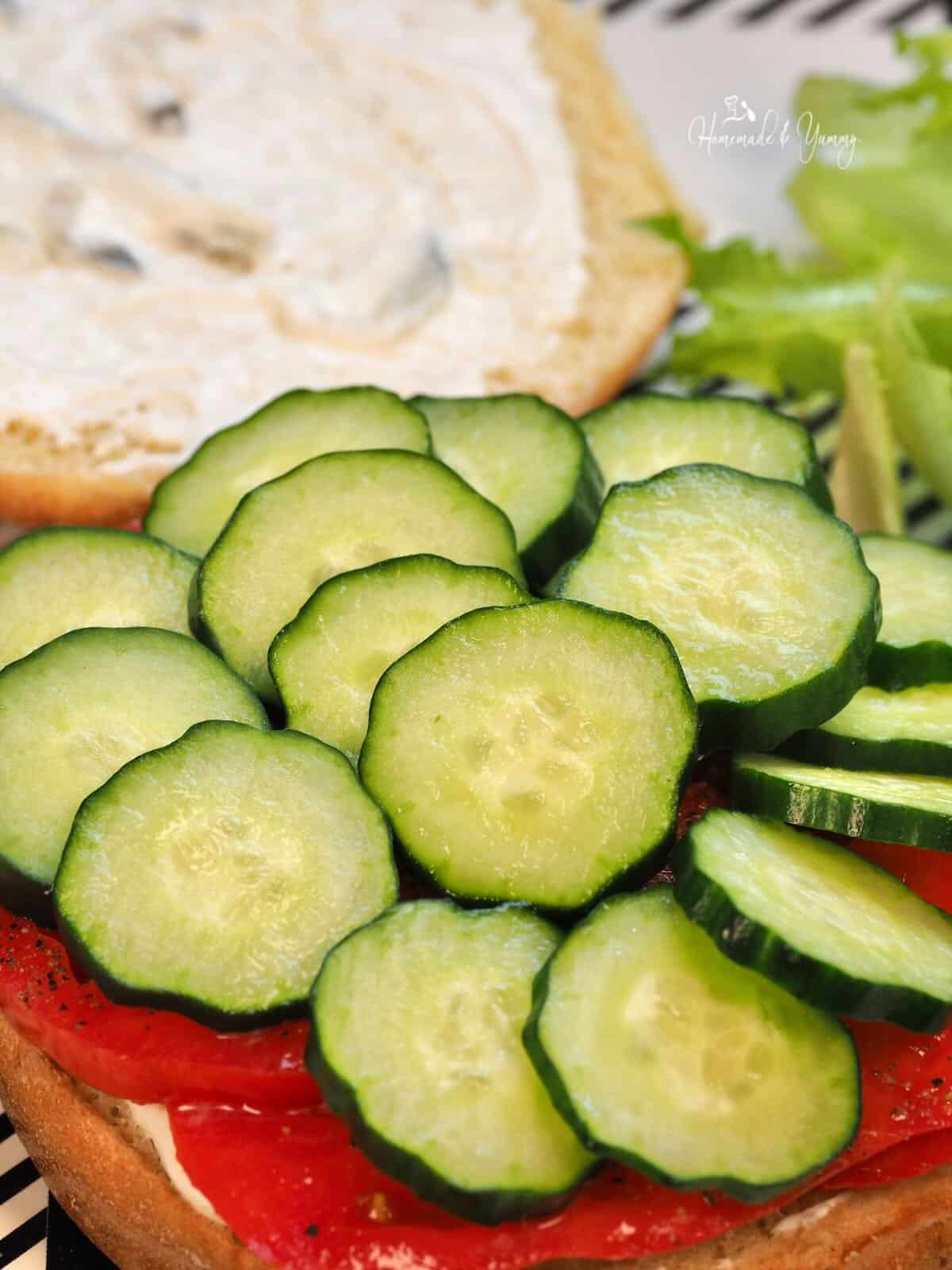 Cucumbers on tomatoes.