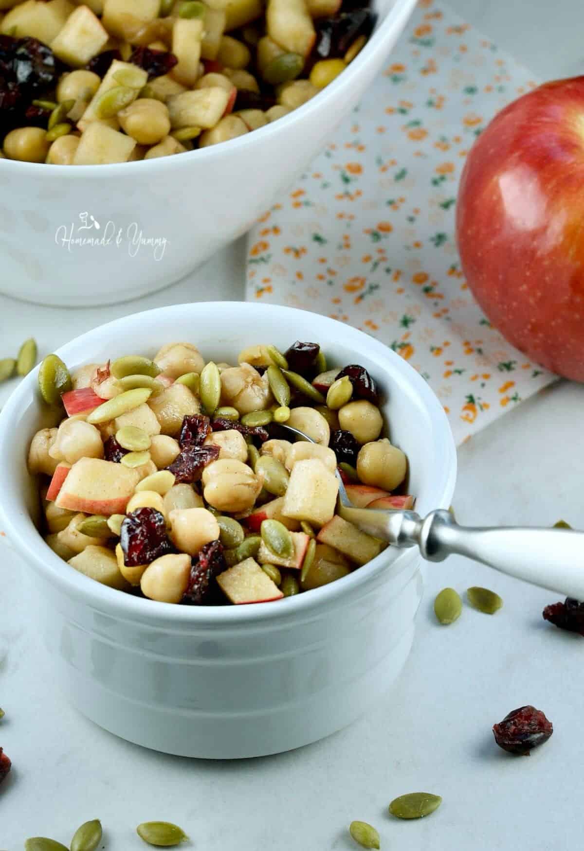Chickpea apple salad with cranberries and pumpkin seeds.