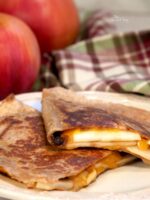 Apple grilled cheese quesadilla on a plate.