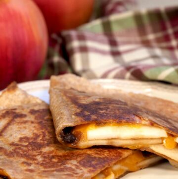 Apple grilled cheese quesadilla on a plate.